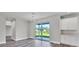 Bright dining room with hardwood floors and sliding glass doors leading to the backyard at 9245 Zorn St, Port Charlotte, FL 33981