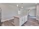 Open kitchen layout with island and view to living area at 9245 Zorn St, Port Charlotte, FL 33981
