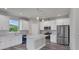 Modern kitchen with stainless steel appliances and white cabinets at 9245 Zorn St, Port Charlotte, FL 33981
