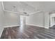Open living room with hardwood floors, high ceilings, and neutral color palette at 9245 Zorn St, Port Charlotte, FL 33981