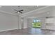 Spacious living room featuring hardwood floors and sliding glass doors at 9245 Zorn St, Port Charlotte, FL 33981