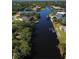 Aerial view of waterfront homes and lush landscape at 13654 Allamanda Cir, Port Charlotte, FL 33981