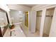 Bright bathroom with vanity, shower, and ample closet space at 1 Colony Point Dr # 5C, Punta Gorda, FL 33950