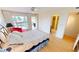 Bedroom with large window and red chair at 1 Colony Point Dr # 5C, Punta Gorda, FL 33950