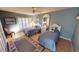 Guest bedroom with twin beds, window seating, and nautical decor at 1 Colony Point Dr # 5C, Punta Gorda, FL 33950