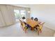 Dining area with wood table and chairs, water view at 1 Colony Point Dr # 5C, Punta Gorda, FL 33950