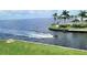 Relaxing waterfront view with jet ski and palm trees at 1 Colony Point Dr # 5C, Punta Gorda, FL 33950