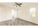 Spacious bedroom with wood-look floors and ceiling fan at 1309 Nackman Rd, North Port, FL 34288