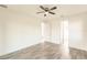 Bright bedroom with wood-look floors and ceiling fan at 1309 Nackman Rd, North Port, FL 34288