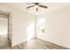 Light-filled bedroom featuring wood-look floors and a ceiling fan at 1309 Nackman Rd, North Port, FL 34288