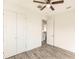 Bedroom with double doors leading to a large closet and view into kitchen at 1309 Nackman Rd, North Port, FL 34288