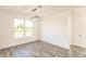 Bright dining room features wood-look floors and a modern chandelier at 1309 Nackman Rd, North Port, FL 34288