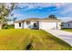 One-story home with a two-car garage and front yard at 1309 Nackman Rd, North Port, FL 34288