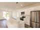 White kitchen with stainless steel appliances and island at 1309 Nackman Rd, North Port, FL 34288