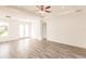 Spacious living room with wood-look floors and double doors at 1309 Nackman Rd, North Port, FL 34288