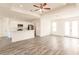 Spacious living room with wood-look floors and ceiling fan at 1309 Nackman Rd, North Port, FL 34288