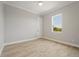 Bright bedroom with wood-look floors and large window at 9453 Zorn St, Port Charlotte, FL 33981