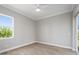 Bedroom with wood-look floors, window, and ceiling fan at 9453 Zorn St, Port Charlotte, FL 33981