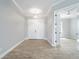 Light and airy entryway with double doors and wood-look floors at 9453 Zorn St, Port Charlotte, FL 33981