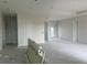 Spacious living room with high ceilings and access to multiple rooms at 9453 Zorn St, Port Charlotte, FL 33981