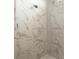 Modern shower with marble tile and a mosaic accent at 9453 Zorn St, Port Charlotte, FL 33981