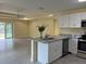 Modern kitchen featuring granite countertops and stainless steel appliances at 22235 Albany Ave, Port Charlotte, FL 33952