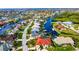 Aerial view of a waterfront community with numerous houses and canals at 1424 Grebe Dr, Punta Gorda, FL 33950