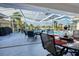 Outdoor dining area overlooking a refreshing pool at 1424 Grebe Dr, Punta Gorda, FL 33950