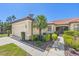 Tan house with garage, walkway, and landscaping at 2539 Thyme Way, North Port, FL 34289