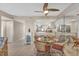 Kitchen view from dining area with glass-top table and wicker chairs at 3670 Bal Harbor Blvd # 1F, Punta Gorda, FL 33950