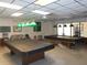 Two billiard tables available in a well-lit recreation room at 5495 Holiday Park Blvd, North Port, FL 34287