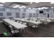 Large community room with tables and chairs at 5495 Holiday Park Blvd, North Port, FL 34287