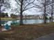 Peaceful pond with fountain and trees at 5495 Holiday Park Blvd, North Port, FL 34287