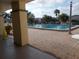 Community pool with brick patio and table at 5495 Holiday Park Blvd, North Port, FL 34287