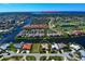 Aerial view of waterfront home with canal access and community at 1429 Blue Jay Ct, Punta Gorda, FL 33950