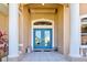 Elegant entryway with double doors and columns at 1429 Blue Jay Ct, Punta Gorda, FL 33950