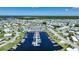 Aerial view of waterfront community with clubhouse and marina at 542 Tampico Dr, North Port, FL 34287