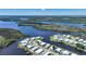 Aerial view of waterfront community with many homes and waterways at 542 Tampico Dr, North Port, FL 34287