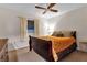 Guest bedroom with queen bed and ceiling fan at 745 Columbia St, Port Charlotte, FL 33948