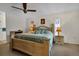 Large bedroom with a king-size bed and ceiling fan at 745 Columbia St, Port Charlotte, FL 33948