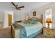 King-size bedroom with ceiling fan and access to patio at 745 Columbia St, Port Charlotte, FL 33948