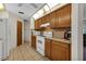 Clean and efficient kitchen featuring wood cabinets and ample counter space at 745 Columbia St, Port Charlotte, FL 33948