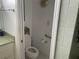 Small bathroom with toilet and grab bar at 18029 Ohara Dr, Port Charlotte, FL 33948