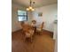 Bright dining area with glass table and wicker chairs at 78 Boundary Blvd # 193, Rotonda West, FL 33947