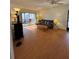 Spacious living room with wood-look floors at 78 Boundary Blvd # 193, Rotonda West, FL 33947