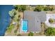 House with private pool, waterfront access, and lush landscaping at 2132 Abscott St, Port Charlotte, FL 33952