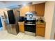 Modern kitchen with stainless steel appliances and granite countertops at 2132 Abscott St, Port Charlotte, FL 33952