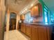 Kitchen with granite countertops and wood cabinets at 2132 Abscott St, Port Charlotte, FL 33952