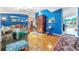 Bright living room with hardwood floors and a view to the dining area at 2132 Abscott St, Port Charlotte, FL 33952