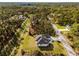 Beautiful overhead shot showing home nestled in a lush, private, wooded neighborhood at 5823 Kumquat Ave, North Port, FL 34291